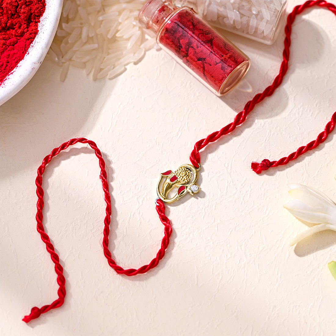 Auspicious Lord Ganesh Ji CZ Gold Plated Silver Thread Rakhi