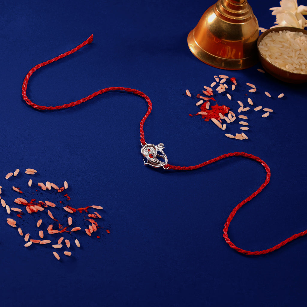 Auspicious Lord Ganesh Ji CZ Gold Plated Silver Thread Rakhi