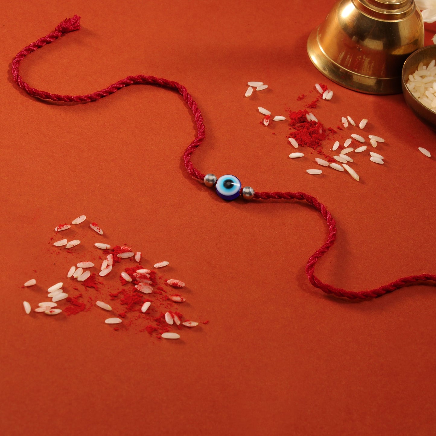 Evil Eye White Stone Silver Thread Rakhi (ALVINA Signature)