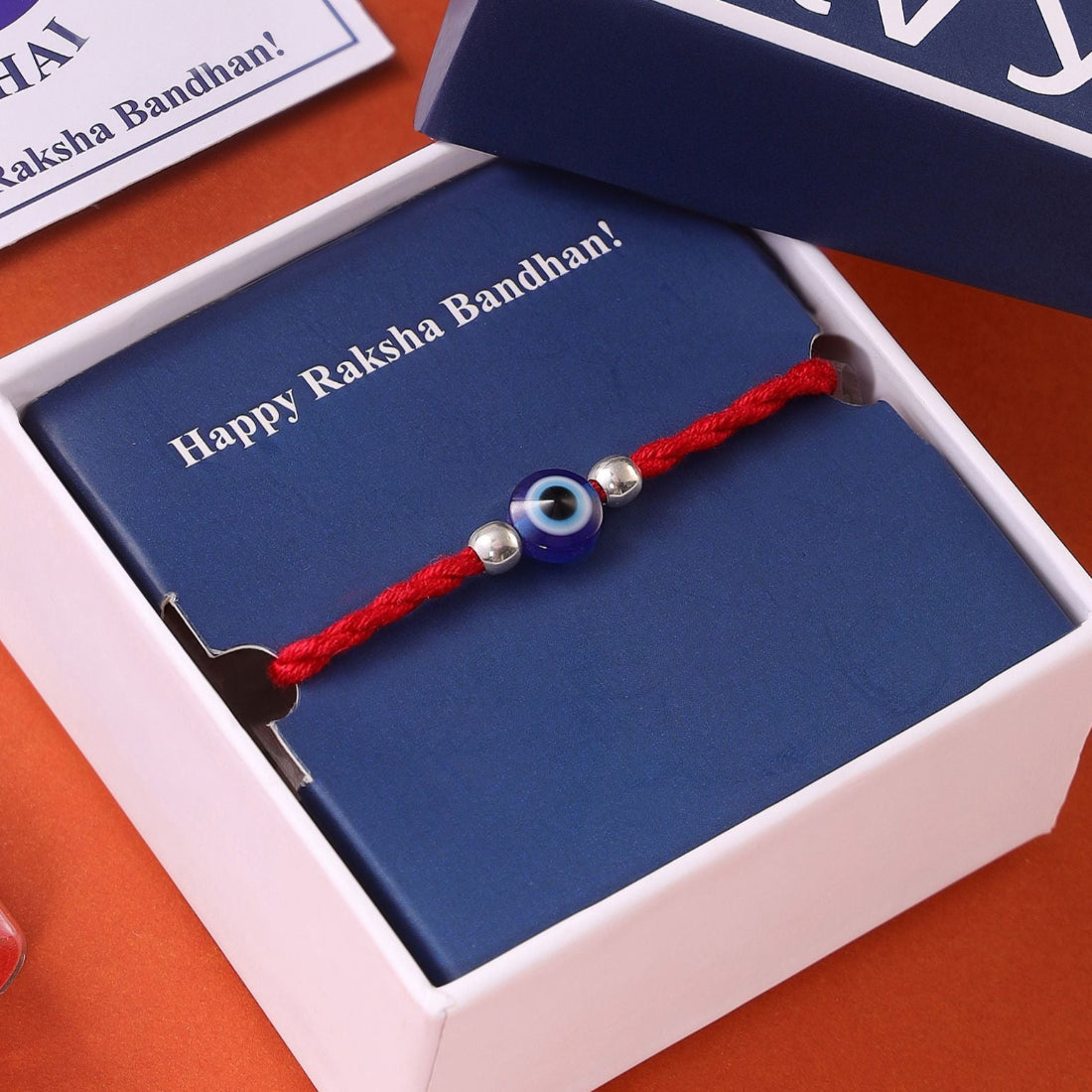 Evil Eye White Stone Silver Thread Rakhi (ALVINA Signature)