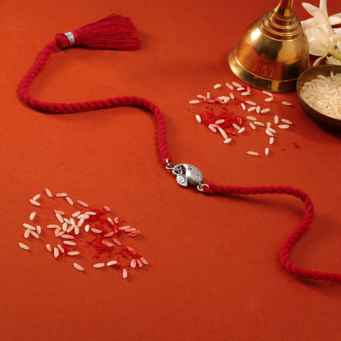 Divine Ganesh Ji Rhodium-Plated Silver Thread Rakhi