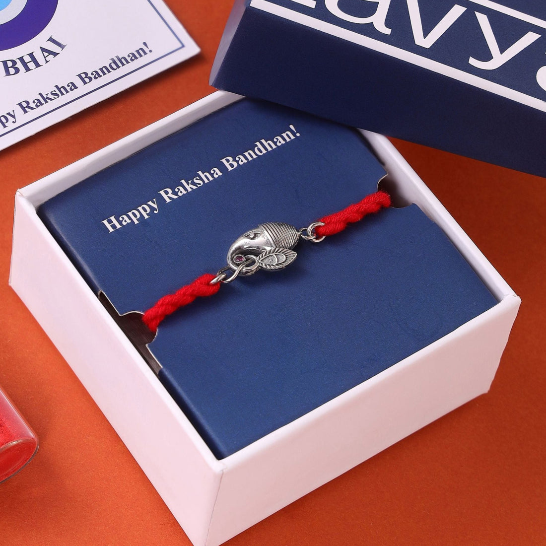 Divine Ganesh Ji Rhodium-Plated Silver Thread Rakhi
